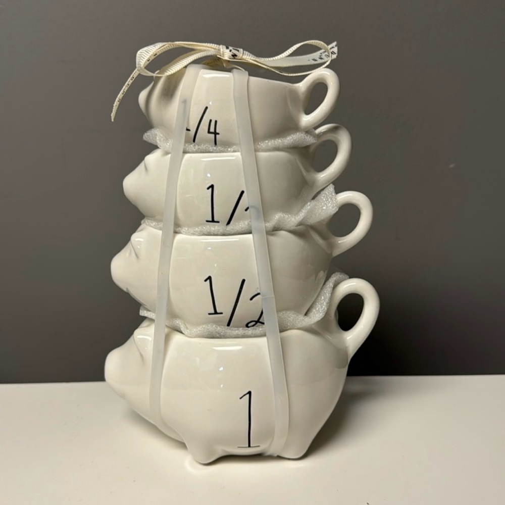 Rae Dunn pig-themed 4-piece measuring cup set from the 2024 collection